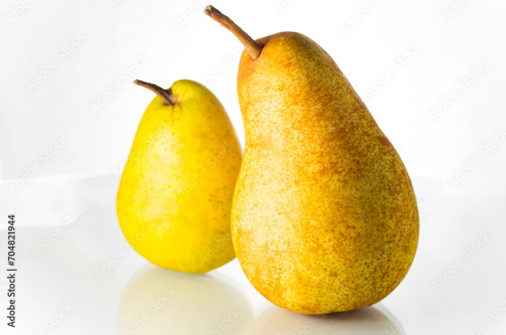 Two ripe yellow pears on a white background Two ripe yellow pears on a white background