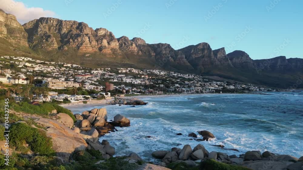 Dive into the beauty of Camps Bay, South Africa, with stunning drone footage over the Atlantic. Experience coastal serenity and majestic landscapes in this day-captured video. Dive into the beauty of Camps Bay, South Africa, with stunning drone footage over the Atlantic. Experience coastal serenity and majestic landscapes in this day-captured video.