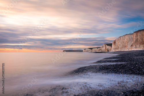 January sunset high tide at Birling gap and the seven sisters cliffs on the east Sussex coast south east England UK photo