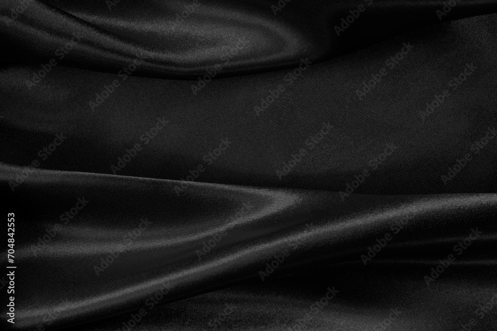 Black grey fabric texture background, detail of silk or linen pattern. Black grey fabric texture background, detail of silk or linen pattern.