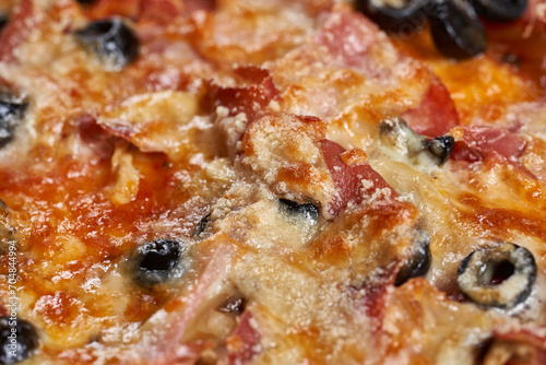 Macro shot showing details with melted parmesan on a pizza