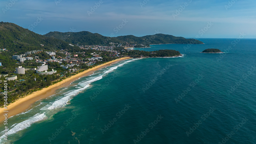 Beautiful beach with colorful water. Top view of the beautiful coastline. Sunny summer day. Colorful water. Sandy beach.	