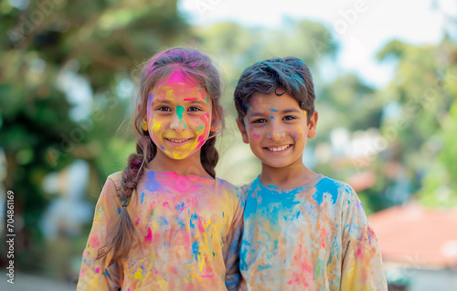 Joyful Siblings Celebrating Holi in Vibrant Colors