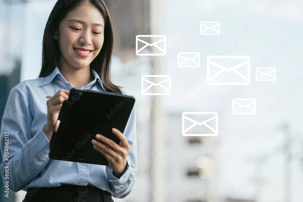 Email notification concept, Business woman use Tablet and laptop receive message alert in the mailbox. Email notification concept, Business woman use Tablet and laptop receive message alert in the mailbox.