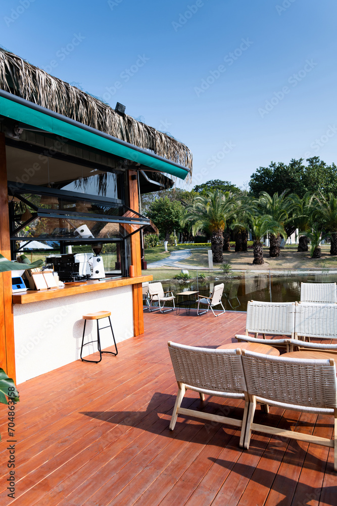 Fototapeta premium Tables and chairs at the lakeside cafe