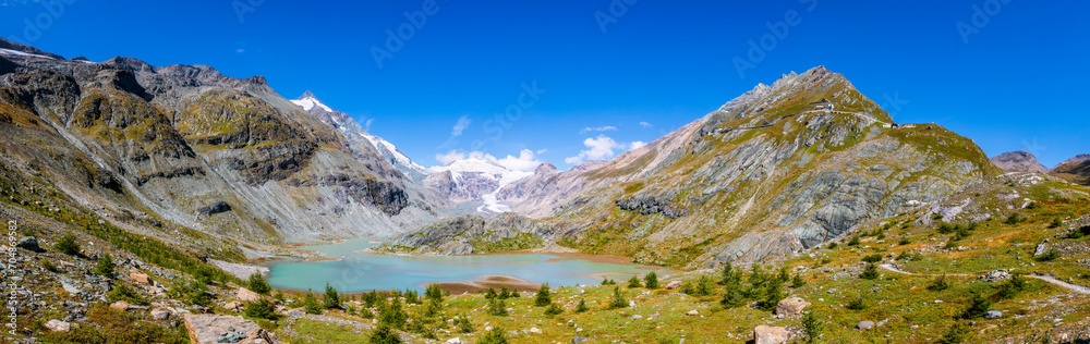 Sandersee lake with mountains on sunny day at Grossglockner, Austria Sandersee lake with mountains on sunny day at Grossglockner, Austria