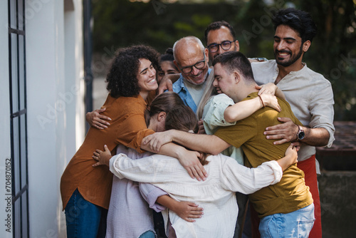 Diverse group of community members embracing successful community project photo