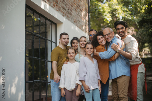 Diverse group of community members embracing successful community project photo