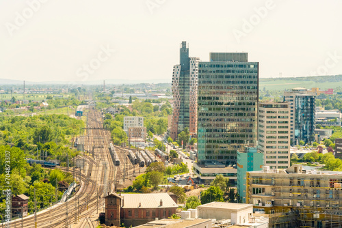 Czech Republic, South Moravian Region, Brno,Modern skyscrapers along railroad tracks photo