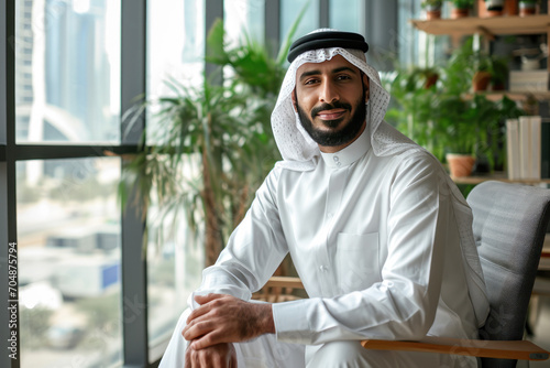 Portrait of middle aged muslim man wearing traditional clothes photo