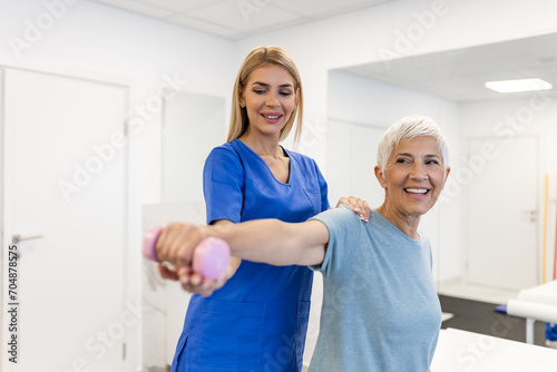 Fotografija Professional therapists is stretching muscles, senior patient with abnormal muscular symptoms, physical rehabilitation therapies and treatment of physiological disorders by physiotherapists concept