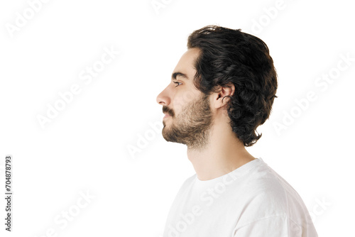 Side view portrait of young attractive man with dark thick curly hair and beard posing in t-shirt against white studio background. Concept of natural beauty, youth, spa treatment, selfcare, cosmetic.