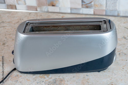 Modern toaster on a marble countertop. Close-up.