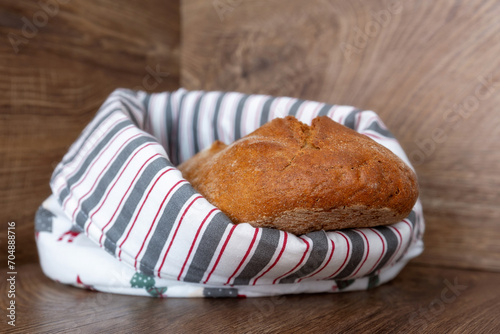 Loaf of freshly baked bread in cotton textile bag