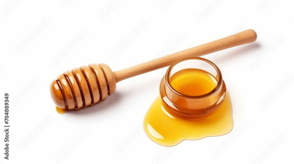Honey splash and wooden dipper isolated on a white background. Honey splash and wooden dipper isolated on a white background.
