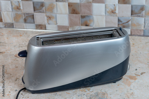 Modern toaster on a marble countertop. Close-up.