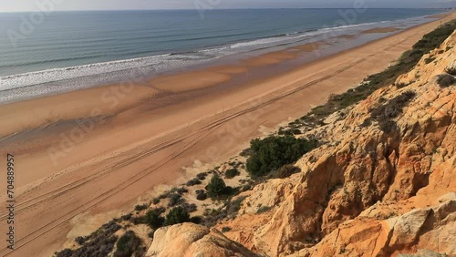 Arenosillo beach, located in Huelva, Spain. Explore the serene beauty of this coastal paradise with its sunlit sandy shores and the rhythmic ebb and flow of the Atlantic Ocean. photo