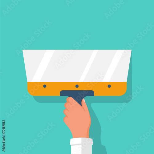 The builder holds a construction spatula in hand. Putty knife in the hand of a home master. Cement trowel. Construction and repair. Apply plaster or putty. Vector illustration flat design.