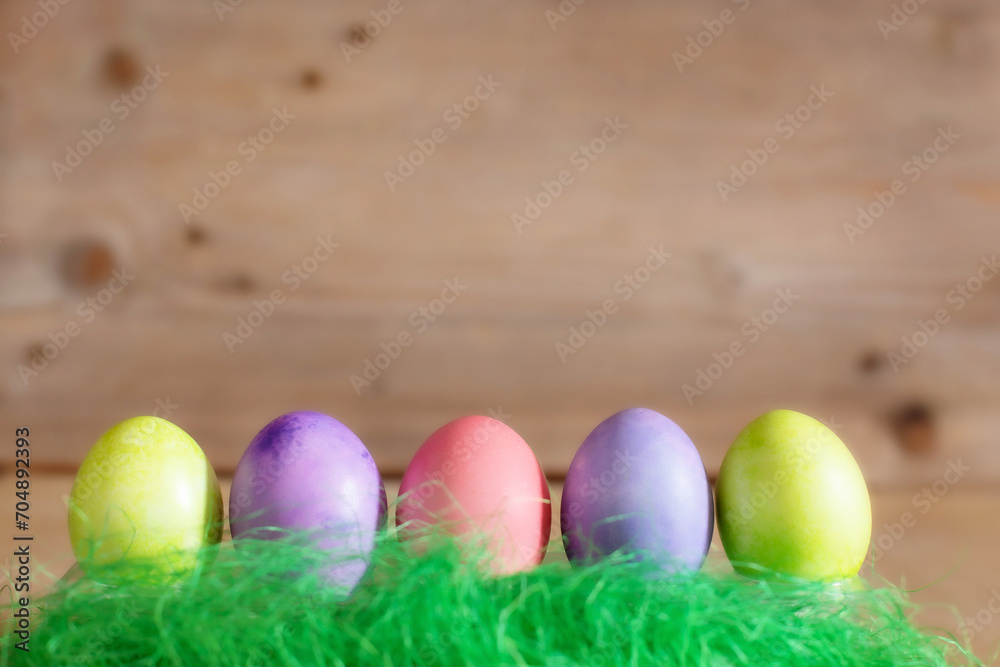 Row of colorful Easter eggs on wooden background copy space Row of colorful Easter eggs on wooden background copy space