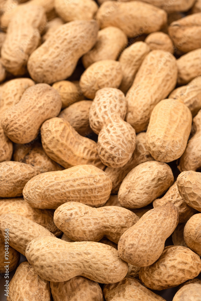 Unshelled peanuts as a background, top view. Food peanut closeup Unshelled peanuts as a background, top view. Food peanut closeup