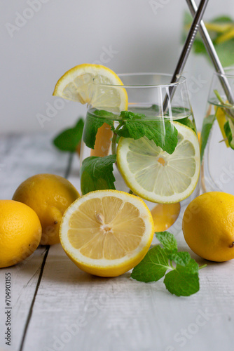 Lemonade with fresh lemon and mint. wooden on a white background. A healthy lifestyle