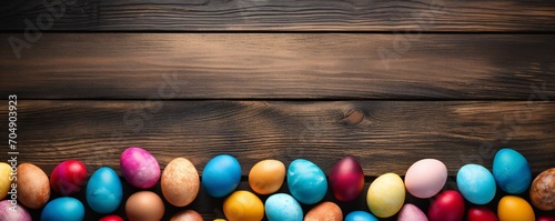 Colorful easter eggs on wood plank top desk background, above view Generative AI