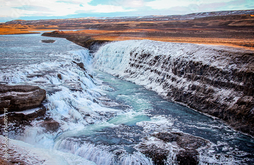 The view of Gullfoss Waterfall covered by ice and snow in winter 