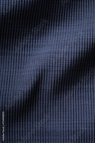 Vertical of a blue woven wavy fabric background