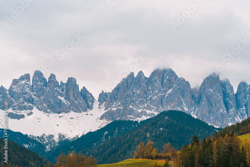 Trekking and Tourism in the Dolomites. A Grand Adventure in the Snowy Wilderness. A Serene and Majestic View of the Snow-Covered Dolomites in the Sunset Light