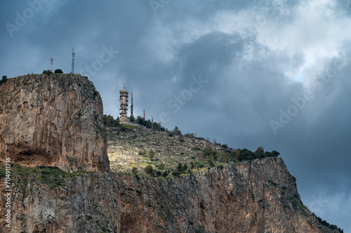 Rocks of the Mount Pellegrino with a communication antenna on top around Aranella, Italy photo
