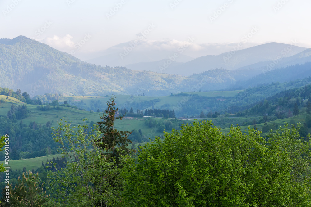 Mountain ridges in spring sunny morning in Carpathian Mountains