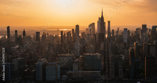 New York City Aerial Evening Cityscape with Stunning Manhattan Landmarks, Skyscrapers and Residential Buildings. Long Wide Angle Panoramic Helicopter View of a Popular Travel Destination © Gorodenkoff