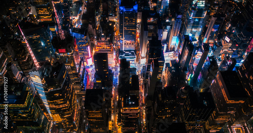 New York Concrete Jungle at Night. Aerial Photo from a Helicopter Tour Around Manhattan. Scenes with Modern Skyscraper Blocking the View on Crowded Times Square Area with Tourists