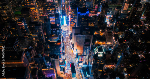 Photography Night Aerial Photo of New York City with Skyscraper Spires and Straight Busy Streets with Cars and Yellow Taxi Vehicles