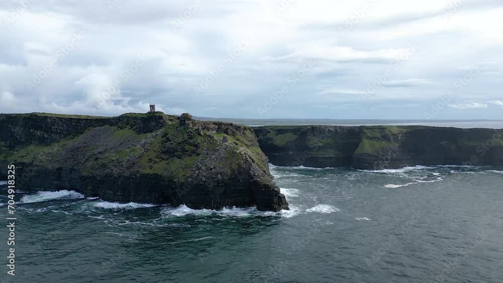 Amazing aerial view of Moher Tower at Hag's Head and Ireland Cliffs at sunset Amazing aerial view of Moher Tower at Hag's Head and Ireland Cliffs at sunset
