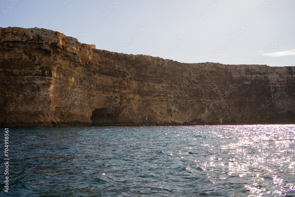 Cliff with cave from Comino island Malta Cliff with cave from Comino island Malta