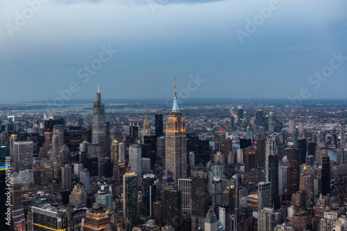 Aerial Image of New York City and Manhattan Panoramic Skyline with Iconic Empire State Building. Helicopter View of the Cityscape from Above with Towering Tourist Attraction
