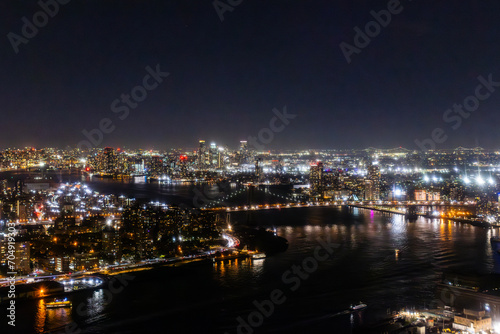Helicopter Tour of New York City Architecture at Night. Midtown Manhattan Office Buildings and Skyscrapers. Aerial Urban Landscape with Lights in the Evening © Gorodenkoff