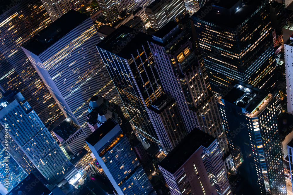 New York City Aerial Night Cityscape with Stunning Manhattan Landmarks, Skyscrapers and Residential Buildings. Helicopter Down View of the Urban Architecture New York City Aerial Night Cityscape with Stunning Manhattan Landmarks, Skyscrapers and Residential Buildings. Helicopter Down View of the Urban Architecture