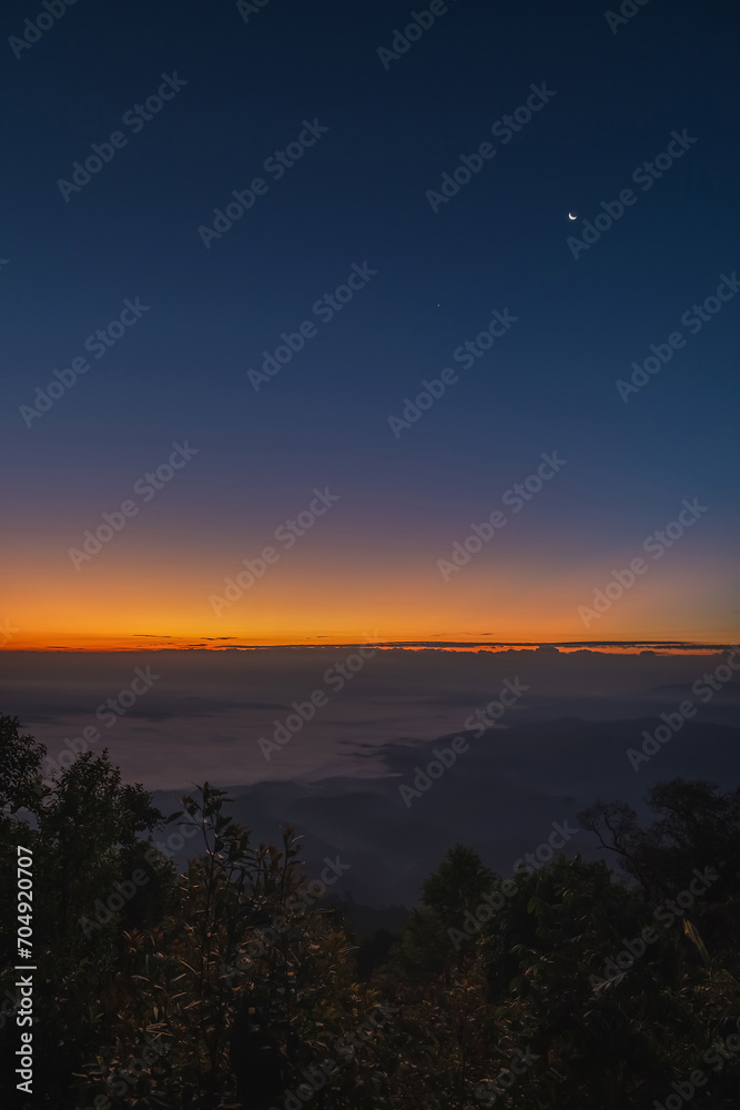 Beautiful autumn dramatic colors sky with mist in the mountains.Morning Amazing nature