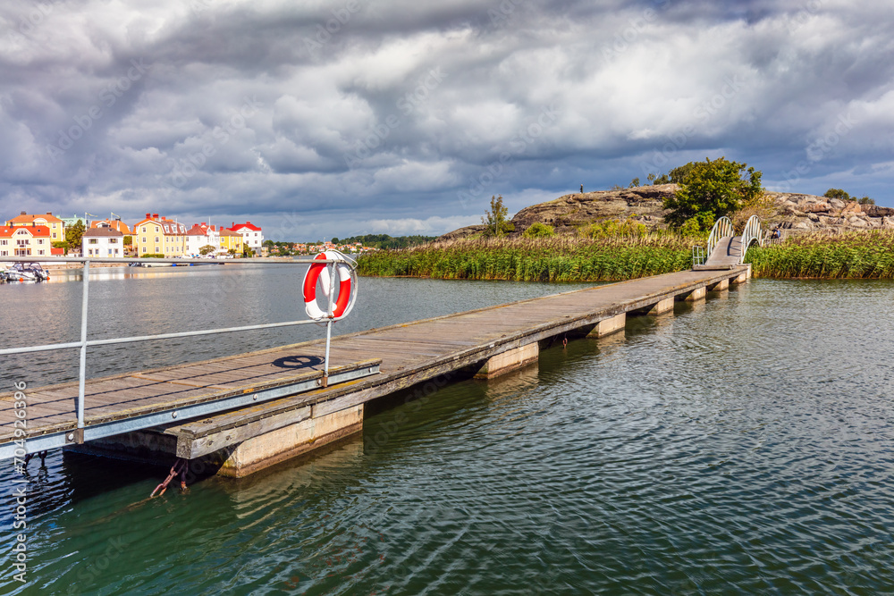 Wooden pier leading to Stakholmen island in Karlskrona, Sweden. Baltic sea