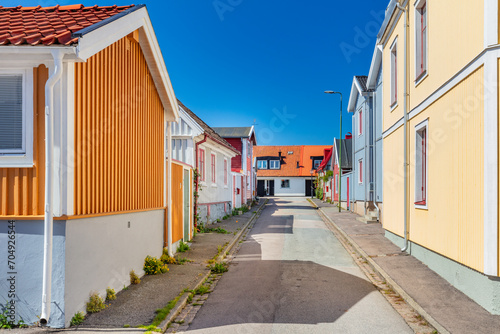 Scandinavian empty street with houses in colored wood in Karlskrona Sweden