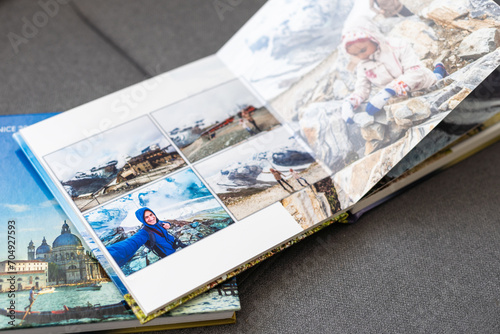 a Photobook of family at home on a background. Photobook is gift. professional photographer and designer. printing of photos and journals in photo laboratory photo