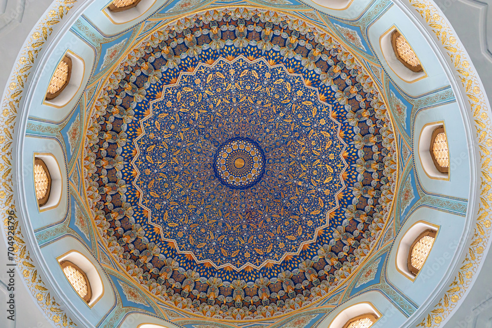 Painted gilded dome of Hazrati Imam mosque. Blue, gold and cyan concentric ornament with floral element. Tashkent, Uzbekistan