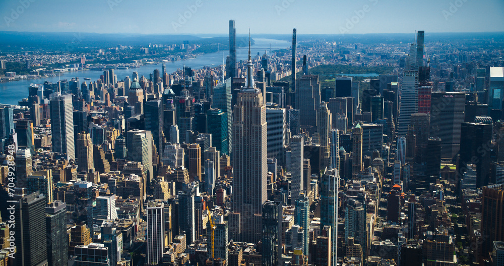 New York City Skyline During Day Time. Aerial Footage from a Helicopter. Empire State Building with Other Famous Urban Landmarks and Skyscraper Buildings. Modern Concrete Jungle Architecture