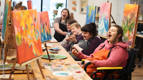 Group of people with intellectual disability painting during group activity photo