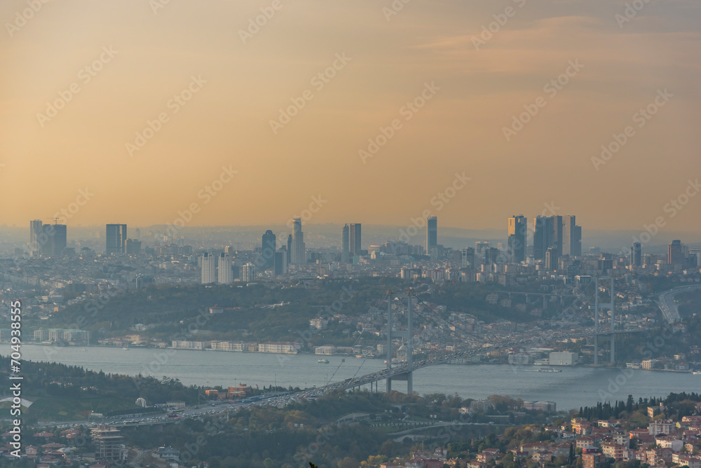 Obraz premium Istanbul Bosphorus Bridge at sunset and evening lights with colorful clouds in the sky