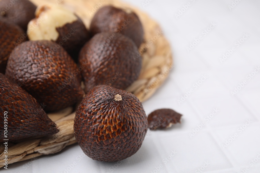 Fresh salak fruits on white table, closeup. Space for text Fresh salak fruits on white table, closeup. Space for text