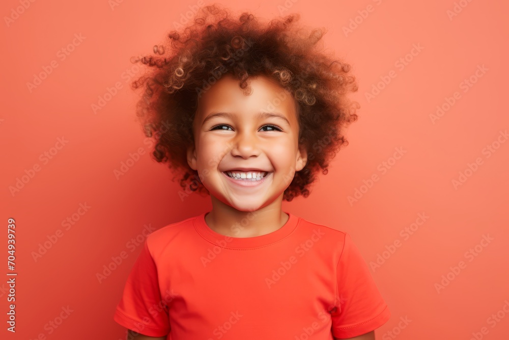 Portrait of a cute african american little girl on a orange background Portrait of a cute african american little girl on a orange background