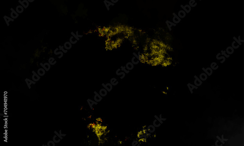 Yellow powder explosion on black background. Colored powder cloud. Colorful dust explode. Paint Holi. Colorful smoke close-up on a black background. Yellow cloud of smoke.